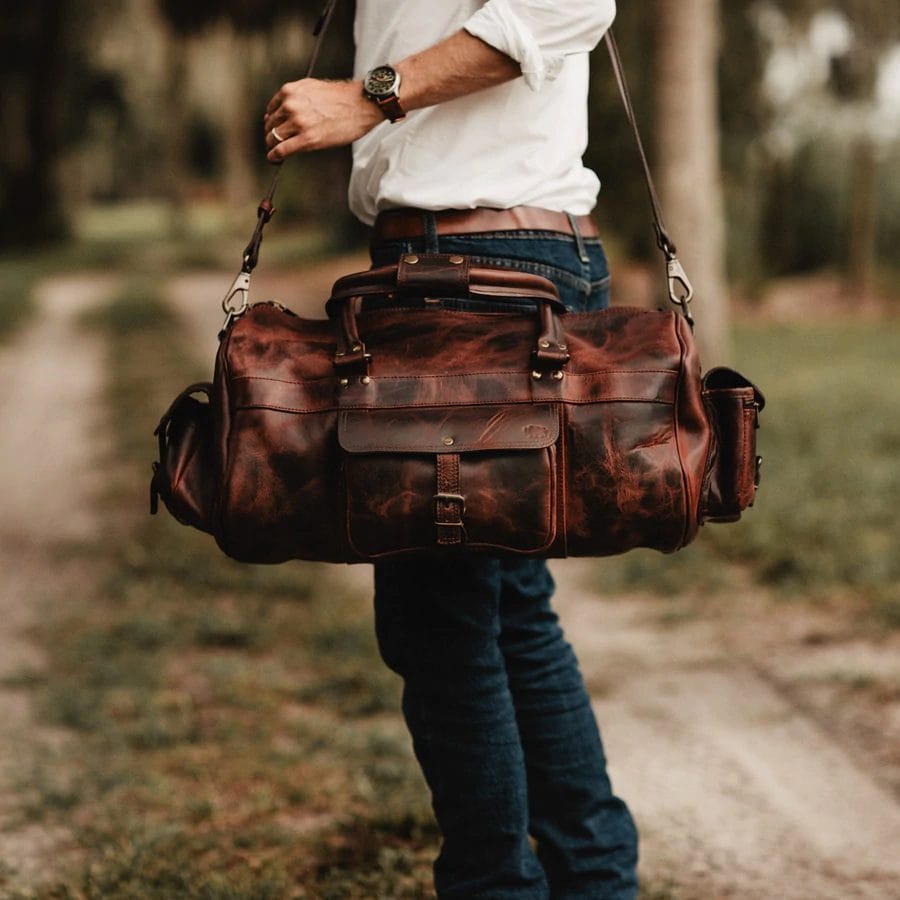 leather bag being carried by a guy